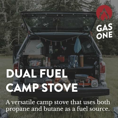 Truck with camping gear and dual fuel camp stove in back.